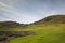 The inner walls of the volcano crater of Rano Raraku with some moais, Easter Island. Easter Island, Chile