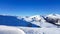 Innerkrems - A panoramic view on the snow covered slopes of Austria. The slopes are ready for skiing. Cloudless, blue sky.