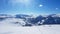 Innerkrems - A panoramic view on the snow covered slopes of Austria. The slopes are ready for skiing. Cloudless, blue sky.