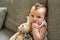 The innocence of an infant. Portrait of an adorable baby girl playing with a teddybear at home.