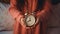 Innocence in Time: A Little Girl\\\'s Hands Grasping an Analog Alarm Clock