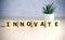 INNOVATE word made with building blocks, business concept