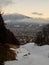 Innsbruck and mountains around viewed through forest