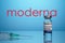 Inoculation Syringe and Covid Vaccine with Moderna Logo