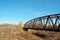 An inoperative road railway bridge requiring restoration and repair in the city of Petrovsk, Russia. A distant view of the