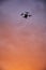 inovation drone with automated external defibrilator aed flying in sunset