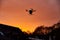 inovation drone with automated external defibrilator aed flying in sunset