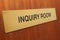 Inquiry room sign on a wooden door.