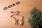 Inscription 2015 Christmas tree and form of moose on a wooden t