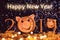 Inscription 2019 with the faces of pigs, the symbol of 2019 on the Chinese horoscope and text Happy New Year against the beautiful