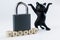 Inscription banned, closed padlock and dancing toy cat on white. Concept of firewall, banned internet forum, chat room, website,