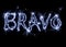 The inscription Bravo on a black background with blue sparklers using a simulated long exposure.