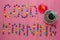 Inscription from candies on a pink background