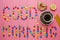 Inscription from candies on a pink background