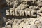 An inscription carved into an Afghan mountain or rock: SALANG. A strategic pass in Afghanistan