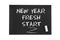 Inscription in chalk on black paper: New year, fresh start