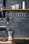 Inscription `Coffee Menu` with chalk on a black wall Kitchens in the style of Loft and Rustic.