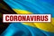 Inscription Coronavirus COVID-19 on Bahamas flag background. World Health Organization WHO introduced new official name for