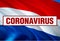 Inscription Coronavirus COVID-19 on Holland flag background. World Health Organization WHO introduced new official name for