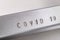 The inscription COVID 19 engraved in an aluminum plate. Permanently engraved inscription in metal