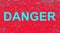 Inscription  danger on a red grunge background. Vector illustration.
