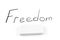 The inscription freedom isolated on a white background.Destruction of freedom