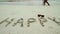 Inscription happy on sand and seascape on a background