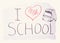 The inscription `I love school`, heart, and backpack on a piece of paper. The creative concept.