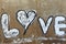 Inscription love on a concrete wall
