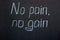 The inscription `no pain, no gain`