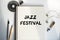 The inscription in the notebook Jazz Festival. Quiet workplace with coffee, headphones and notebooks. A moment of relaxation and