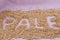 The inscription of pale with malt grains on a lilac textile back