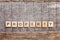 Inscription PROPERTY letters word on wooden background