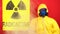 The inscription Radioactivity and the Sign of Radiation in the Smoke in the Background Man in a Protective Suit. The