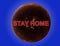 The inscription in red STAY HOME over the planet Venus on a blue background. The concept of lockdown quarantine self-isolation in