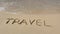 inscription on the sand Travel with waves comes with slow motion on the beach. Concept of vacation and holiday