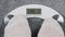 Inscription SOS on bathroom scales digital display