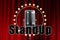 The inscription stand-up, Retro microphone in metallic color on a background of red wings. Concept of stand-up performance, show,