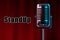 The inscription stand-up, Retro microphone in metallic color on a background of red wings. Concept of stand-up performance, show,