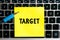 inscription `TARGET` on a yellow sheet of sticker paper on the background of a computer keyboard