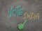The inscription text on the grey board, Vote India