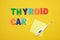 the inscription thyroid care on a yellow background top view copy space