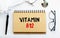 Inscription - VITAMIN B12. Written in a notepad to remind you of what`s important. Top view of the table along with a stethoscope