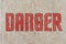 The inscription warning of the danger. Stencil.