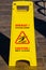 The inscription on yellow information plate caution slippery floor in the hotel in Turkish
