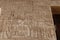 Inscriptions on the walls of the mortuary temple of Medinet Habu in Luxor in Egypt