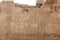 Inscriptions on the walls of the mortuary temple of Medinet Habu in Luxor in Egypt