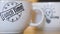 Inscriptions on white mugs. Concept. Close-up of branded mugs with beautiful inscriptions. Coffee mugs with beautiful