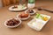 Insect food collection for fried Cricket, Grasshopper and Worm with vegetable salad in the white bowl on the table. Healthy meal