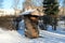 Insect hotel or house in cold winter park in Riga, Latvia. Sign translation from Latvian